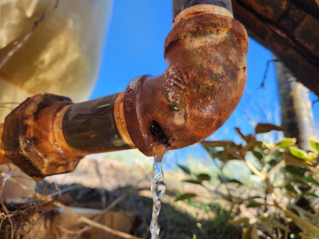 Stainless 1-1/4 inch fittings on pressure-tank piping in Hemet
